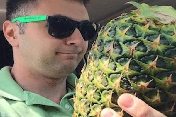 Paul Jackson holding a pineapple
